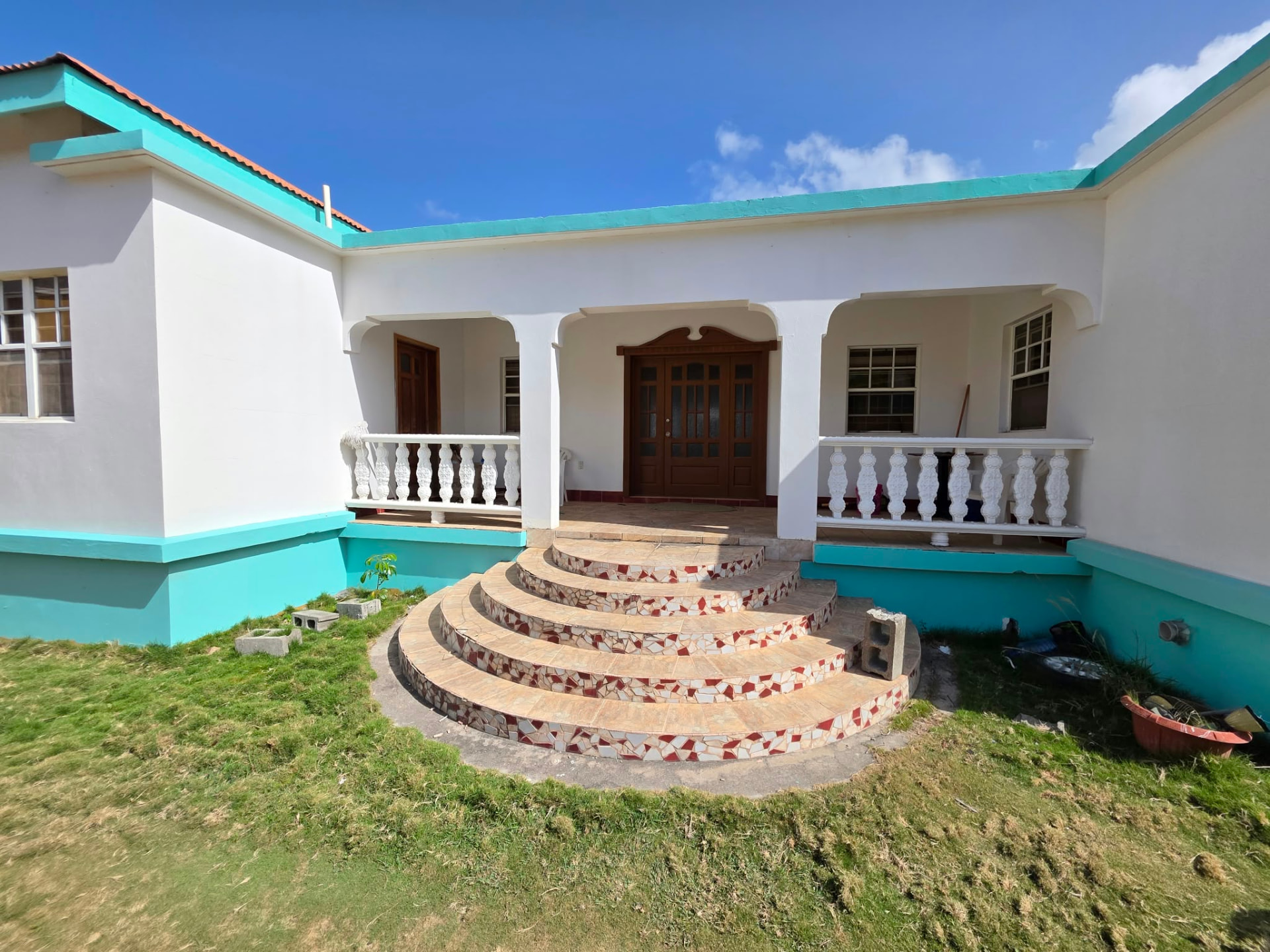 Curved entrance steps and veranda