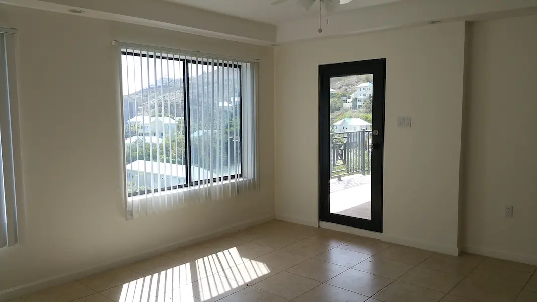 Bedroom with patio door and large window
