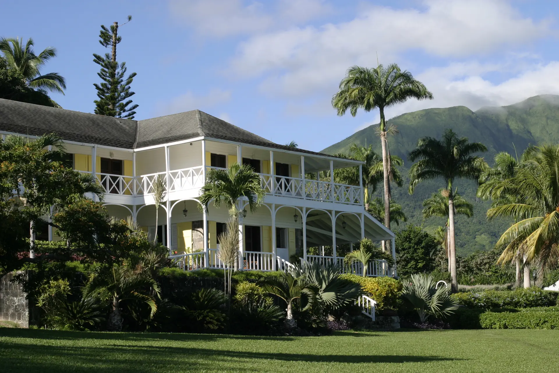The Great House with palms and Mount Liamuiga behind